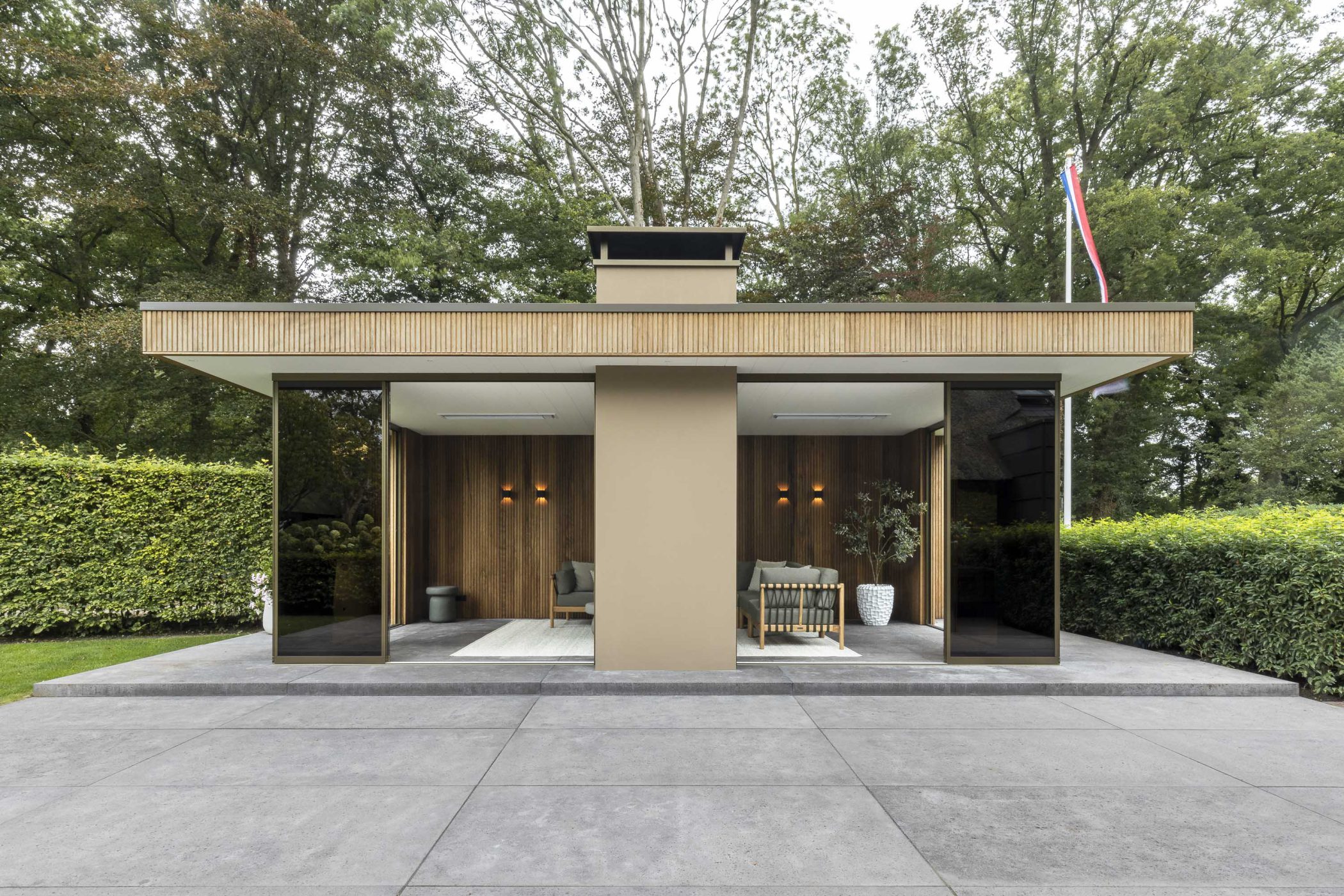 Afbeelding Moderne tuinkamer met haard